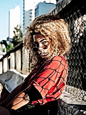Woman leaning on chain link fence
