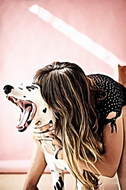 Woman playing with her adult dalmatian