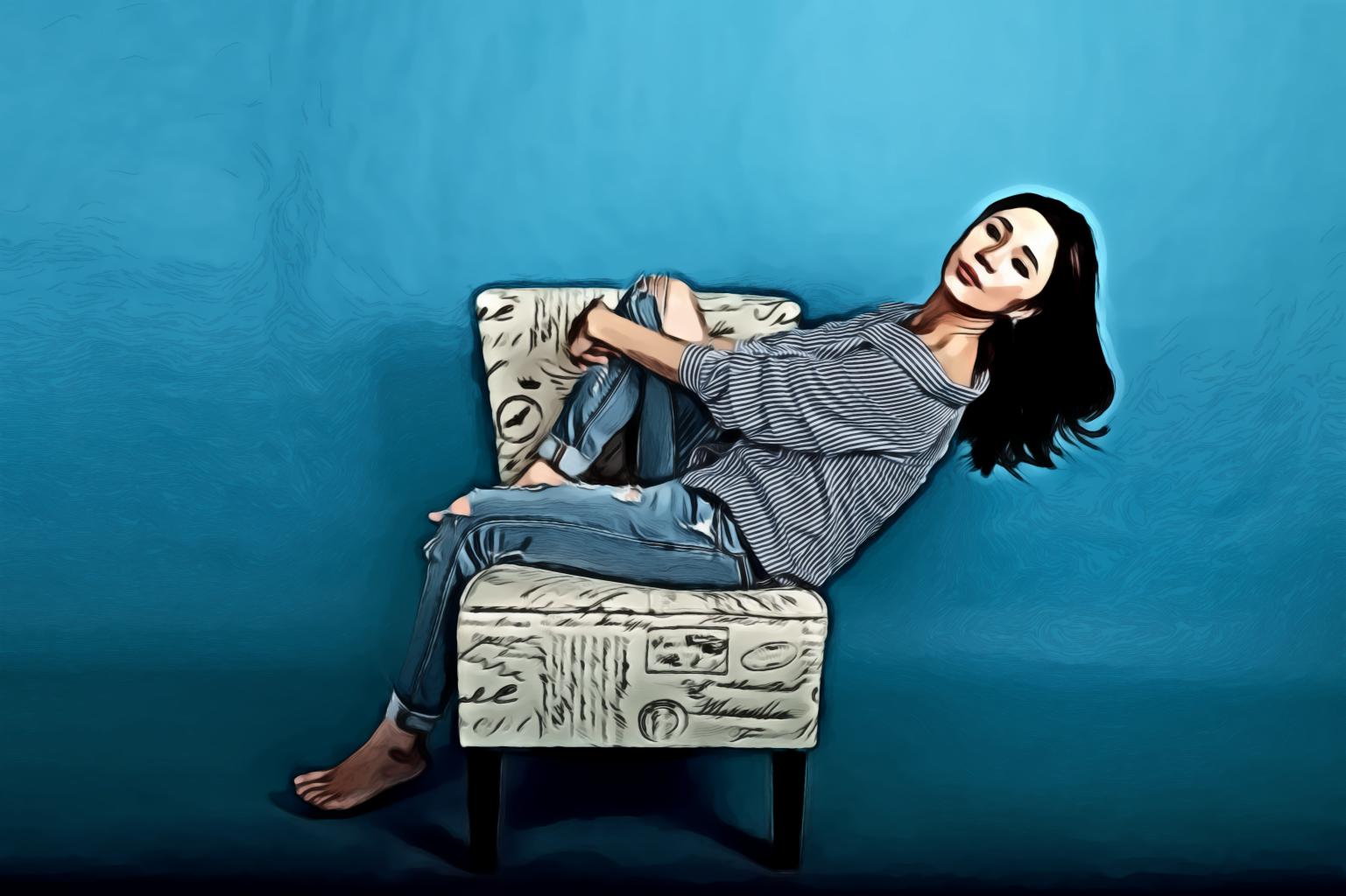 Woman Seating on Chair In Studio