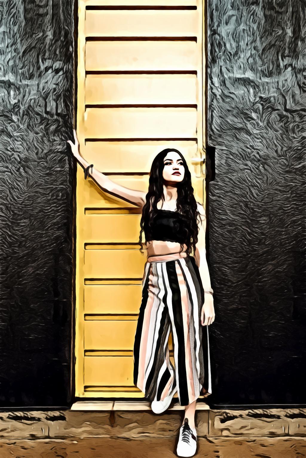 Woman Standing Beside Yellow Metal Door