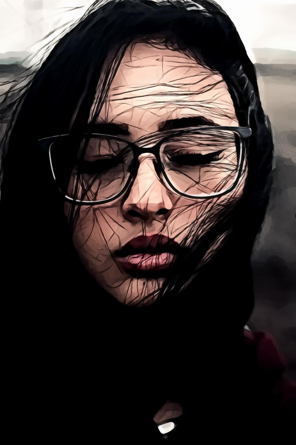 Portrait of woman in black framed eyeglasses with her eyes closed