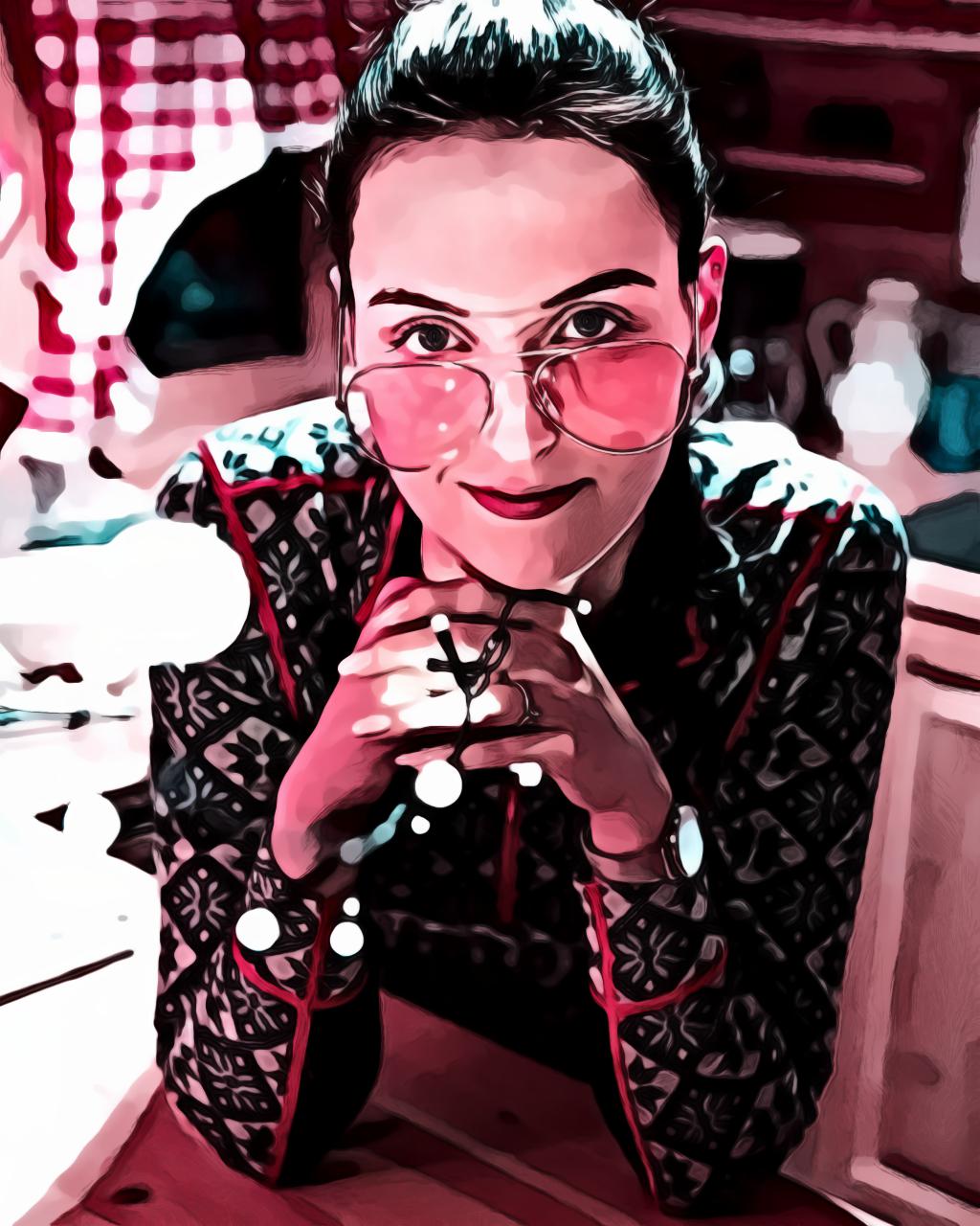 Portrait of woman in sunglasses holding string lights