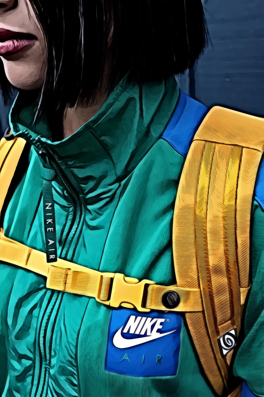 Woman wearing green nike zip top and yellow backpack
